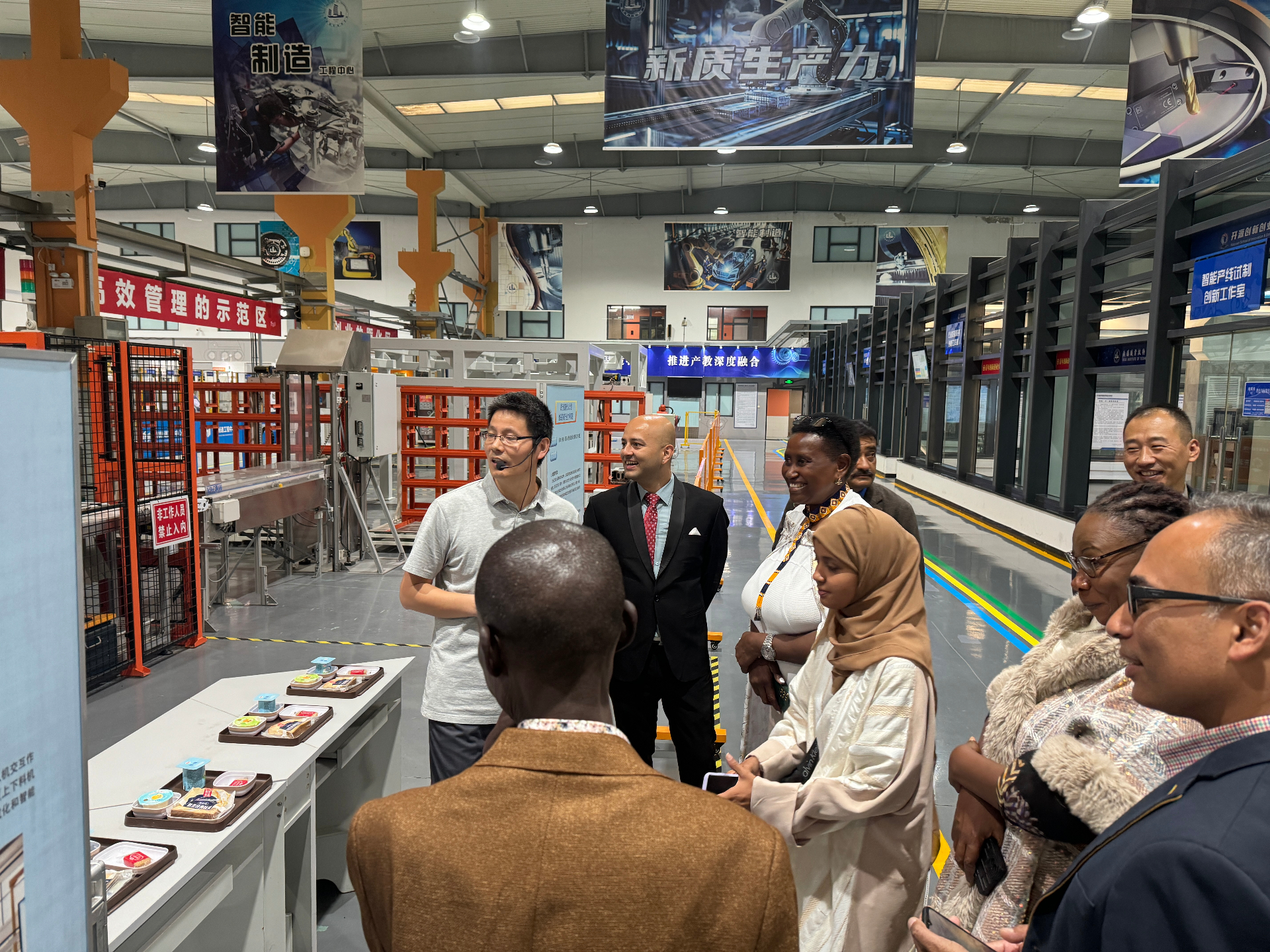 WiseAdmit delegation during a smart manufacturing lab tour at a university in Wuxi, China.